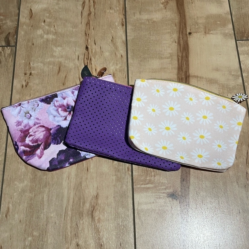 Three small make-up bags,‎ purple, pink, floral